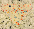 Happy Birthday print dog bandana with party hats, presents and confetti on cream