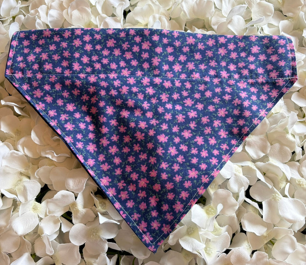 Purple ditzy flower print dog bandana with pink flowers on deep navy background