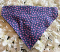 Purple ditzy flower print dog bandana with pink flowers on deep navy background