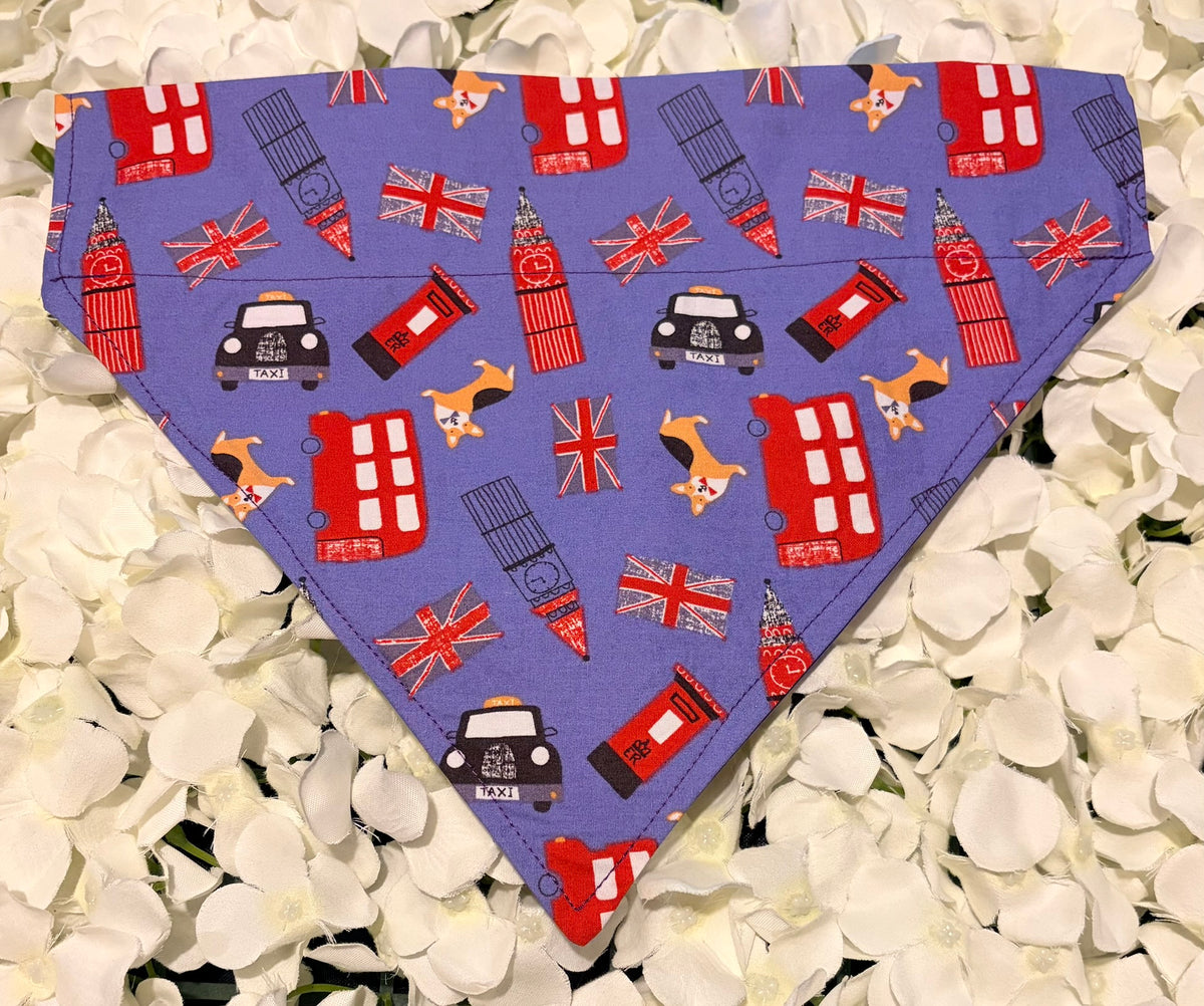 Purple dog bandana with London icons - buses, taxis, Big Ben, Union Jacks - on white petals