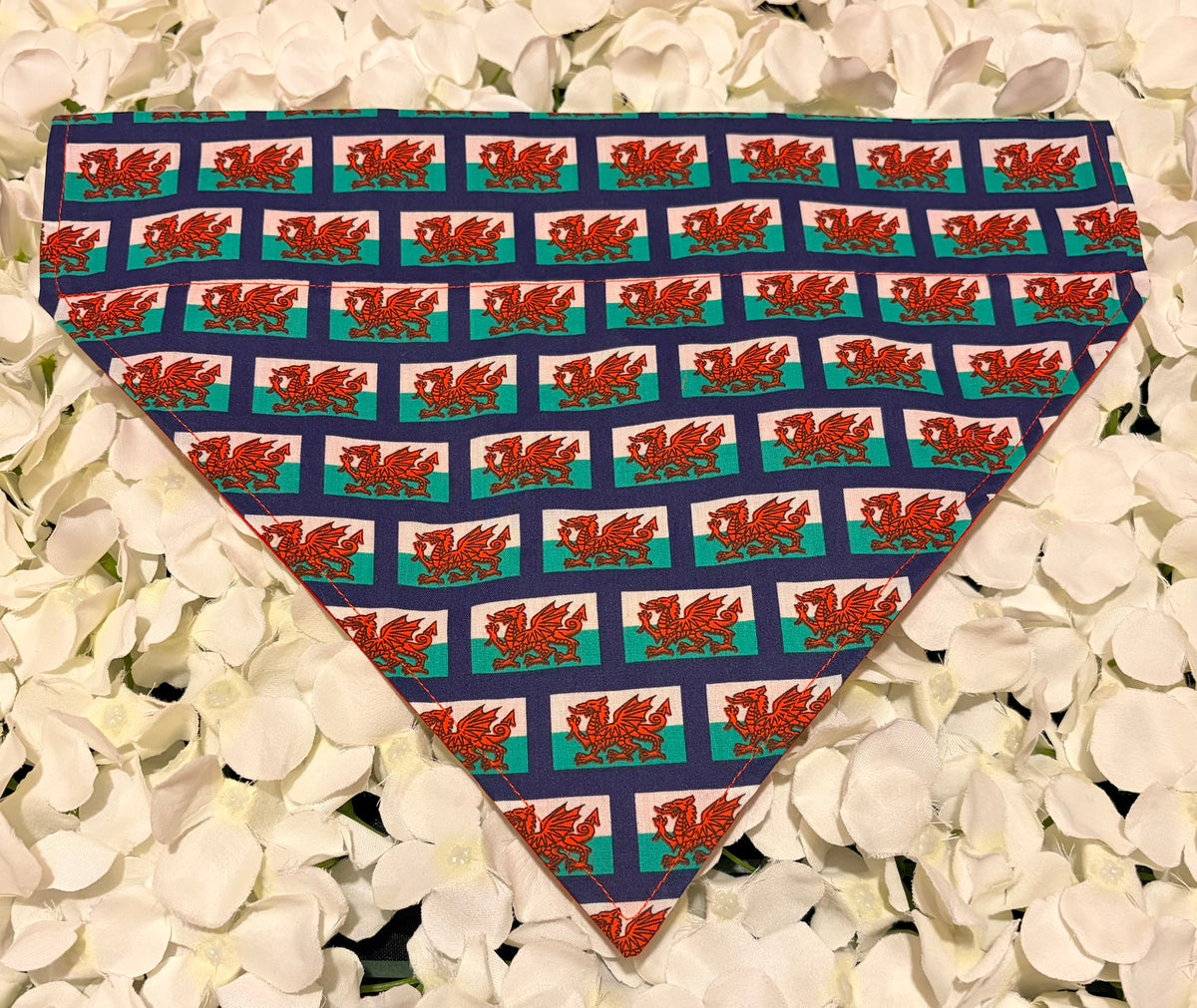 Welsh flag dog bandana with red dragon on green and white background on white petals